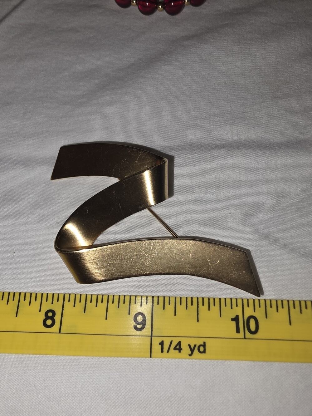 Vintage Monet Gold-Tone Ribbon Brooch